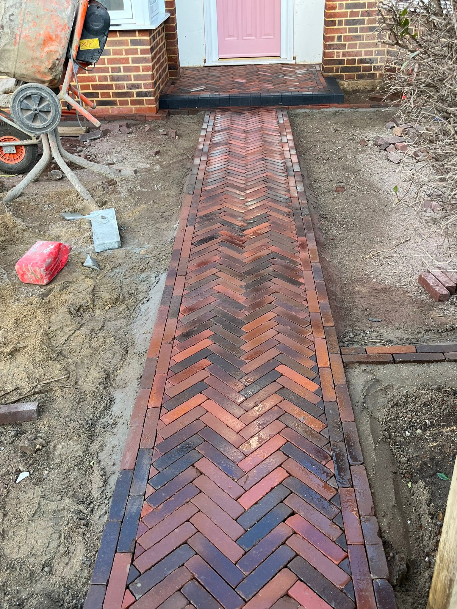 Herringbone brick path during installation