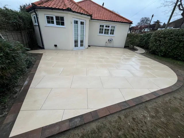 Light sandstone patio in front of a garden room