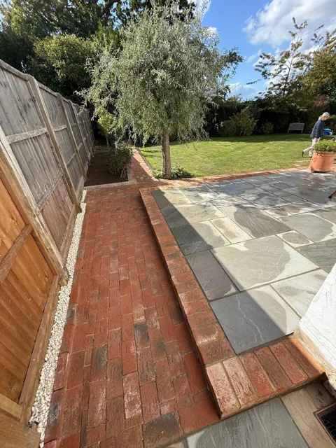 Patio with retaining wall and timber fencing