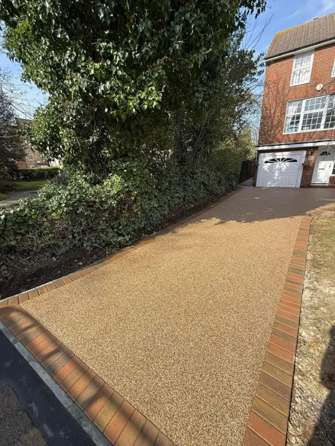 Golden aggregate driveway with block paving edging
