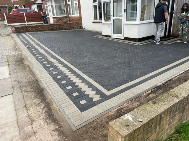 Charcoal block paving driveway with contrast banding