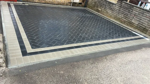 Charcoal block paving with light grey contrast border